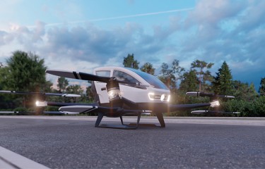 An advanced aerial mobility "flying car" parked on pavement
