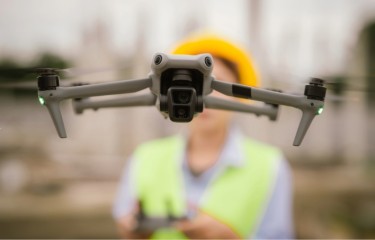 A drone hovering in front of the person flying it