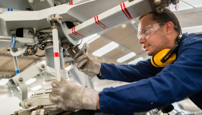 image of an engineer's working on an aircraft