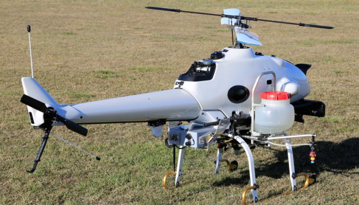 image of a drone is landed on grass