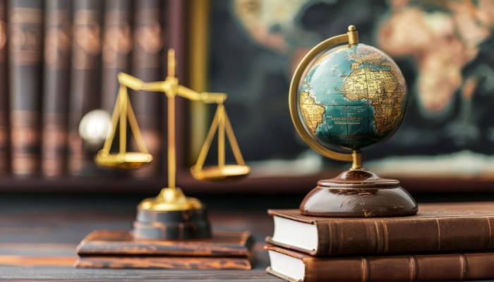image of a desk with a scale and a globe on top