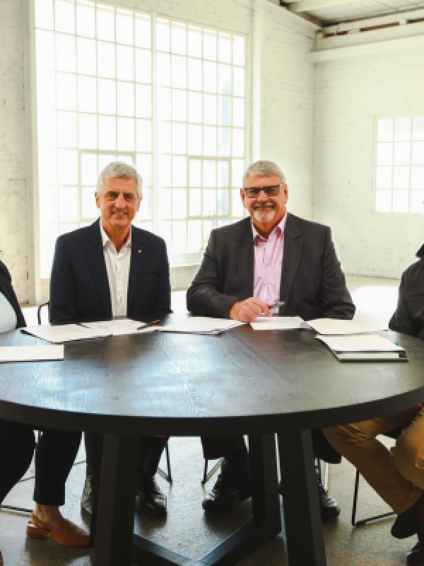 Four expert panellists sitting around a table