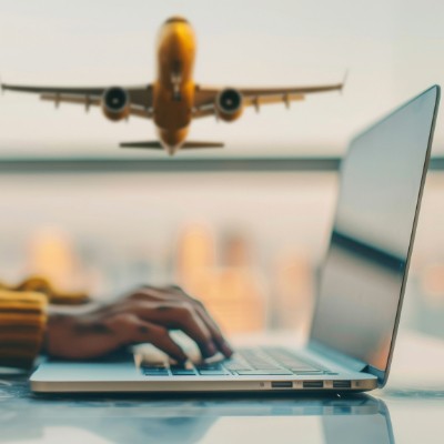 image of a person using laptop at airport